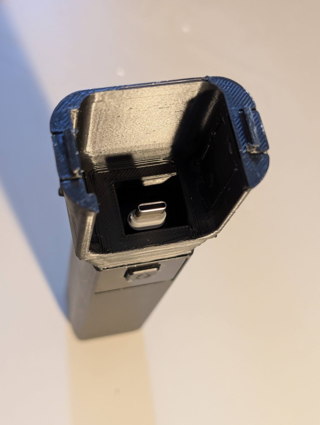 The 3D-printed adapter shell, showing the internal cavity and the USB-C pass-through