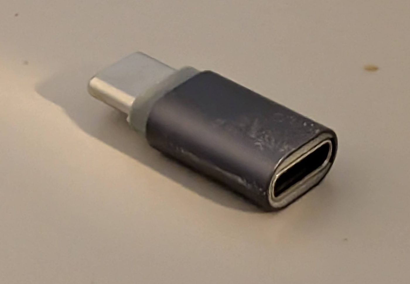 A Basesailor USB-C extender adapter, male to female, on a table